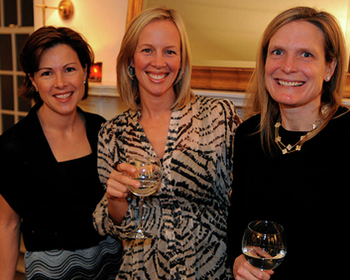 Co-chairwomen of the Near & Far Aid spring gala, from left, Jenny Nelson, Missy Harmon and Lesley O'Connell, shown at the organization's January rare wine party. The event was organized to collect donations of rare wine for auction at the gala
