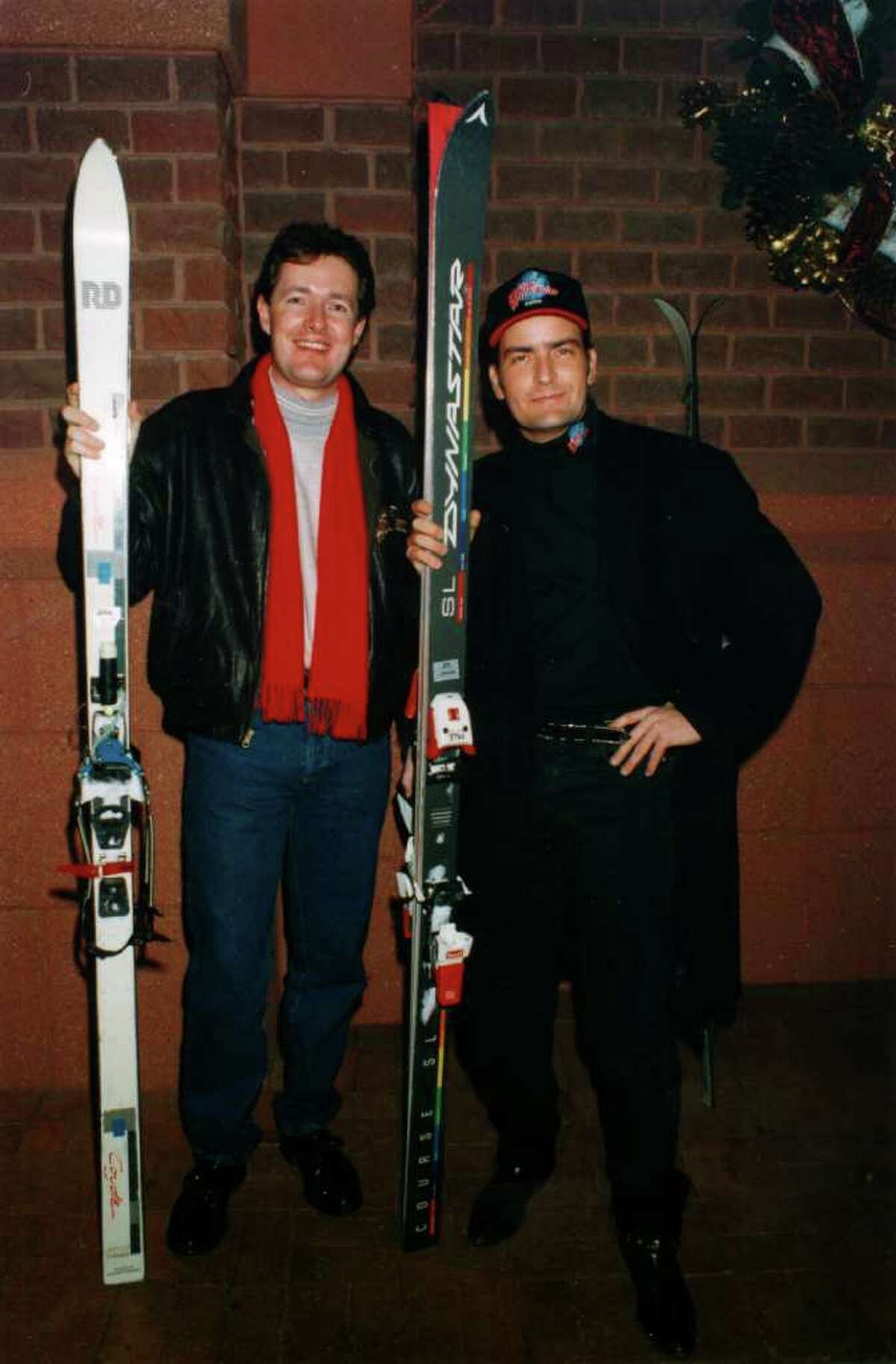 LONDON - FILE PHOTO: Newspaper editor Piers Morgan poses with actor Charlie Sheen during his time as editor of the Bizarre showbusiness column of The Sun newspapers. Piers Morgan edited Bizarre until 1994, when Rupert Murdoch made him Editor of News of The World. 2 years later he moved on to edit the Mirror where he stayed until May 2004 when he was sacked following the decision to publish photos of British soldiers apparently abusing Iraqi prisoners of war. Piers Morgan has been announced as a judge on Simon Cowell's new American talent show 'America's Got Talent' alongside Brandy and David Hasselhoff.