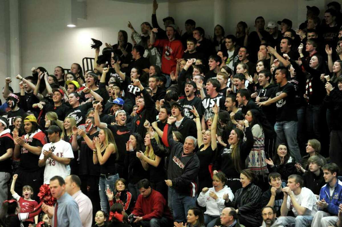 Pomperaug fans cheer for their team during Thursday's SWC boys basketball final at Weston High School on March 3, 2011.