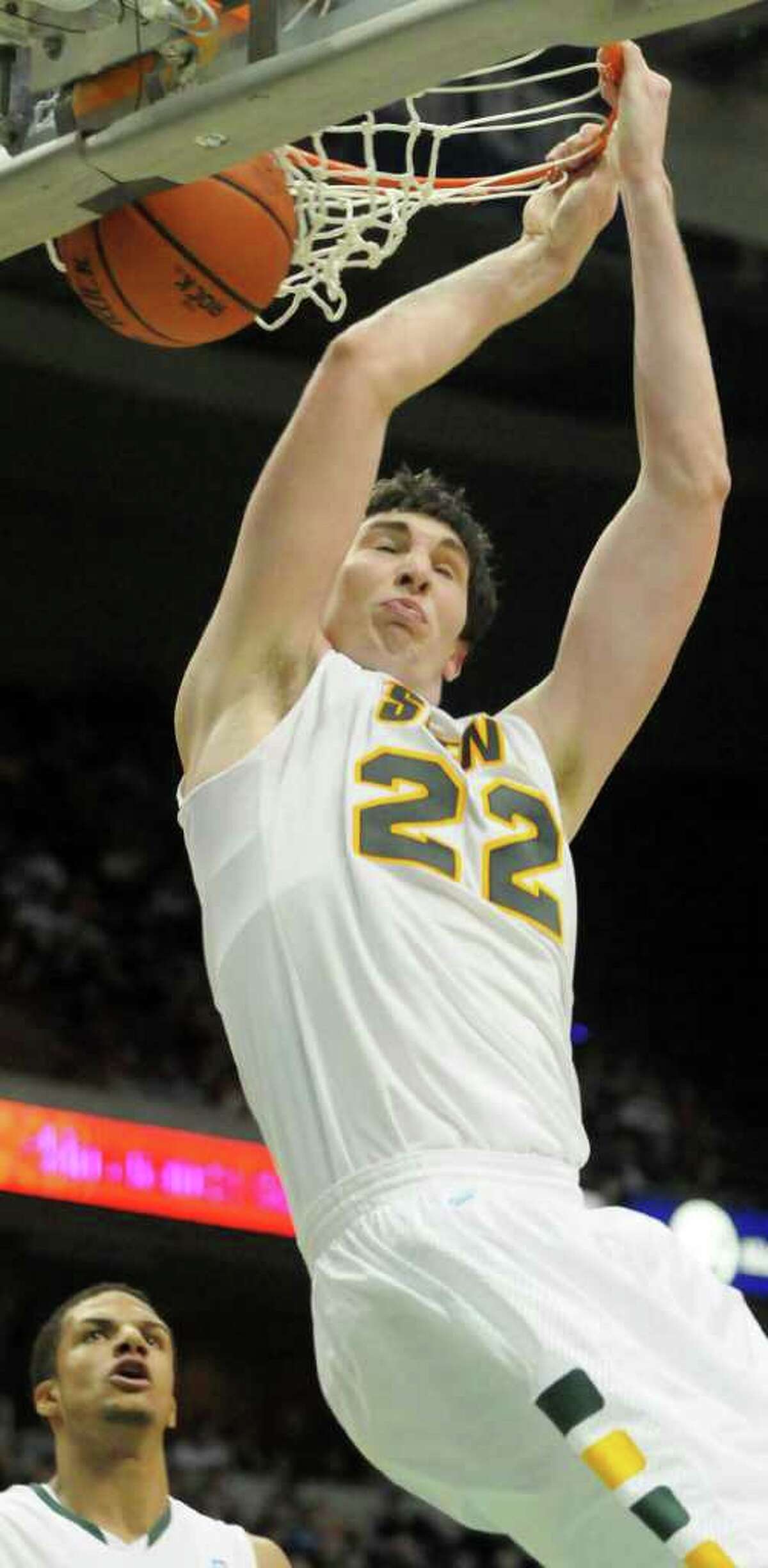 No. 22, Siena's Ryan Rossiter, slams home a dunk in College Basketball vs. Butler at The Times Union Center, in Albany, NY, on Tuesday, Nov. 23, 2010. Siena lost. Photos for Daily Sports Dept. coverage. (Luanne M. Ferris / Times Union)