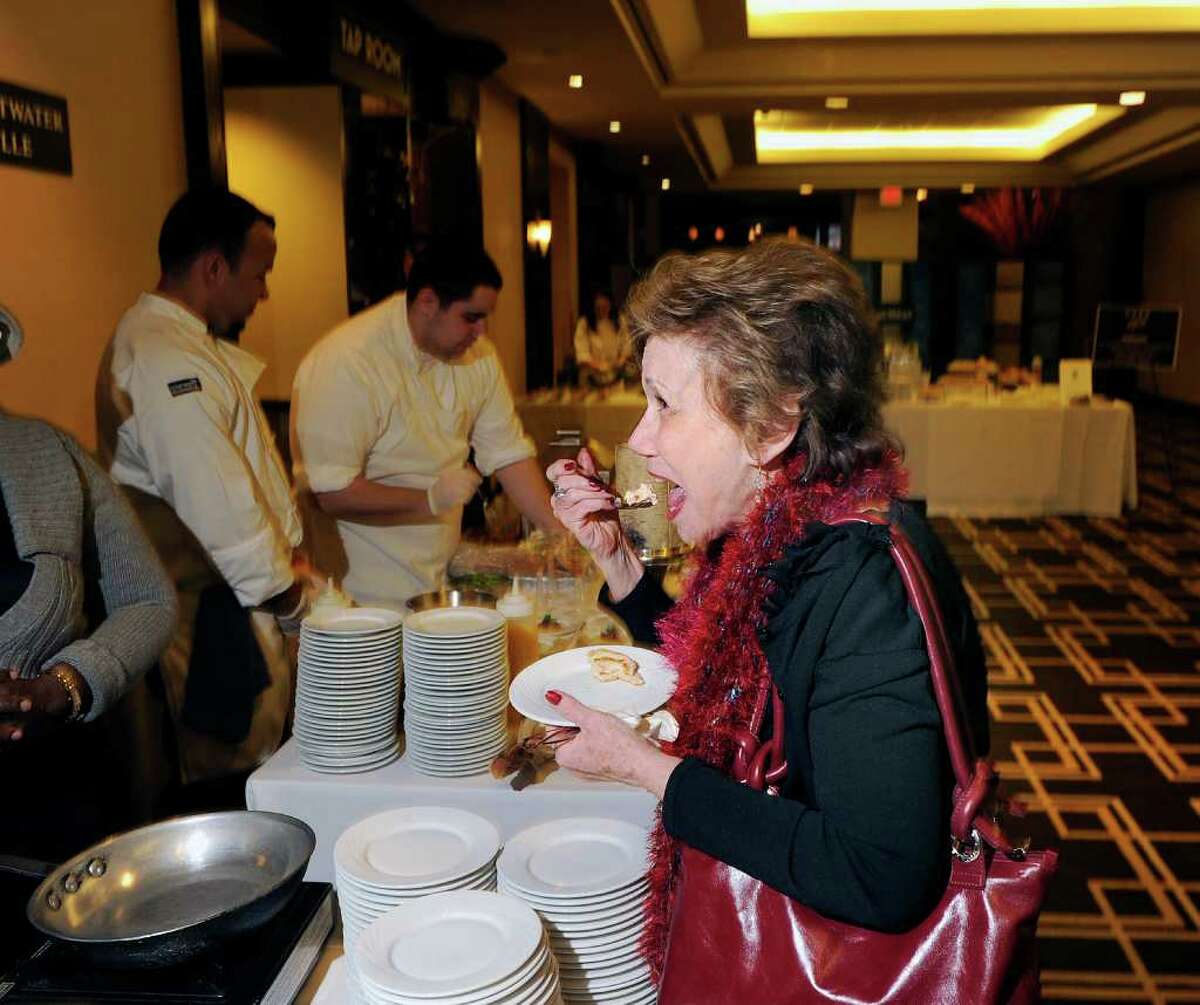 Monica Polikoff of Forest Hills, N.Y., samples the Lobster roll by the Crab Shell Seafood Restaurant of Stamford during the 26th annual Great Chefs at Hyatt Regency Greenwich, Friday night, March 4, 2011.