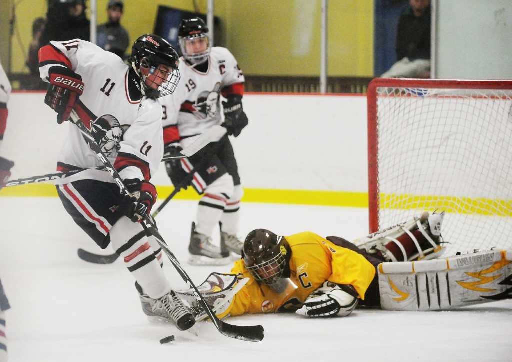 New Canaan wins FCIAC Boys Ice Hockey title 4-3 in OT