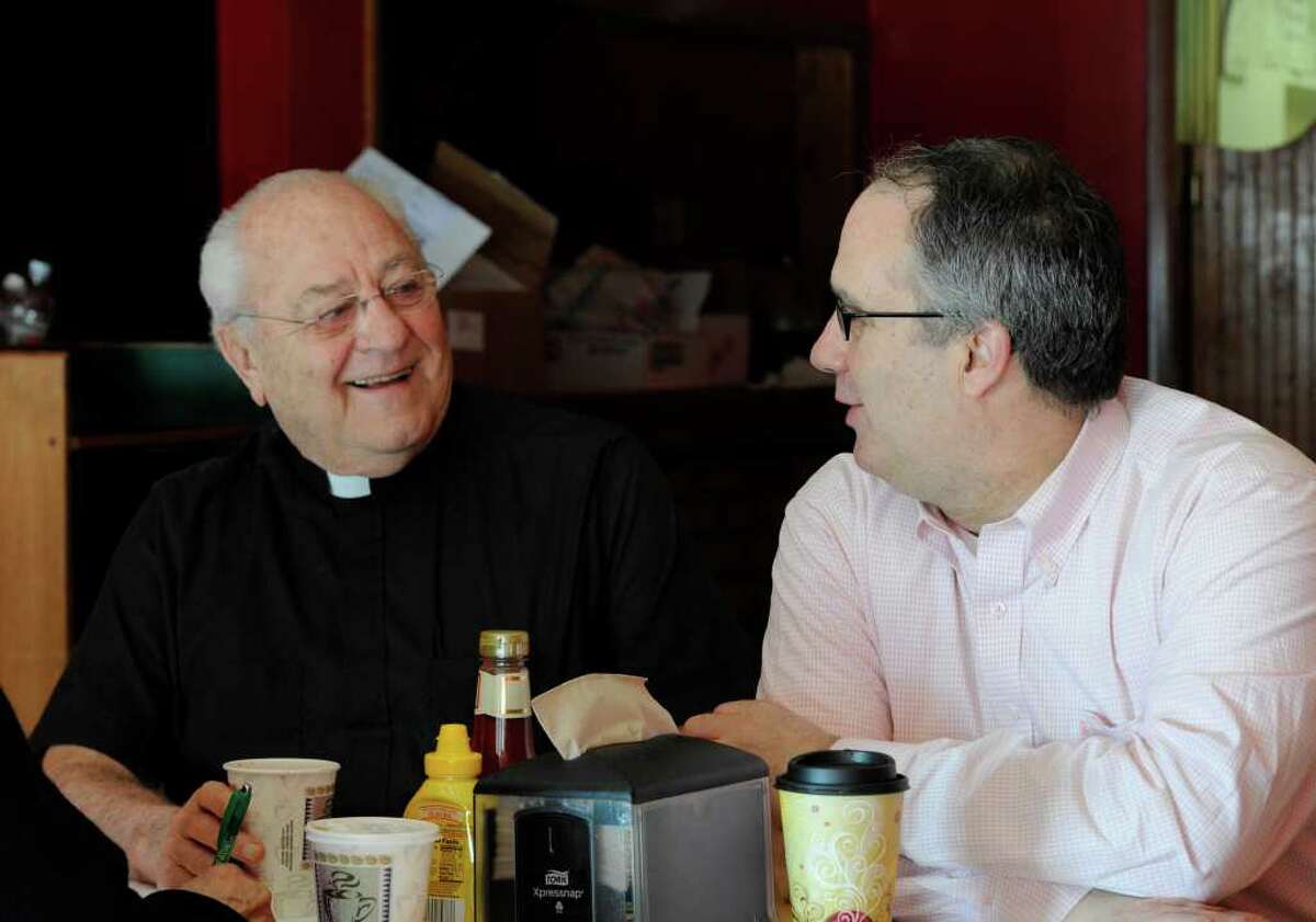 Former Congressman John Sweeney, right, shown March 4, 2011, at the offices of the Rev. Peter Young in Albany, New York. (Skip Dickstein / Times Union)