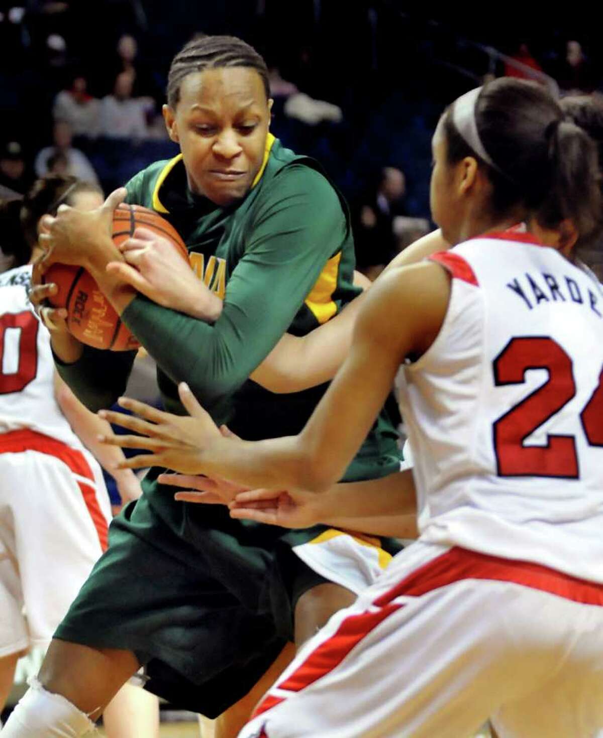Siena's Serena Moore (32), left, secures the rebound during their basketball game against Marist at the MAAC Championships on Saturday, March 5, 2011, at Webster Band Arena at Harbor Yard in Bridgeport, Conn. (Cindy Schultz / Times Union)