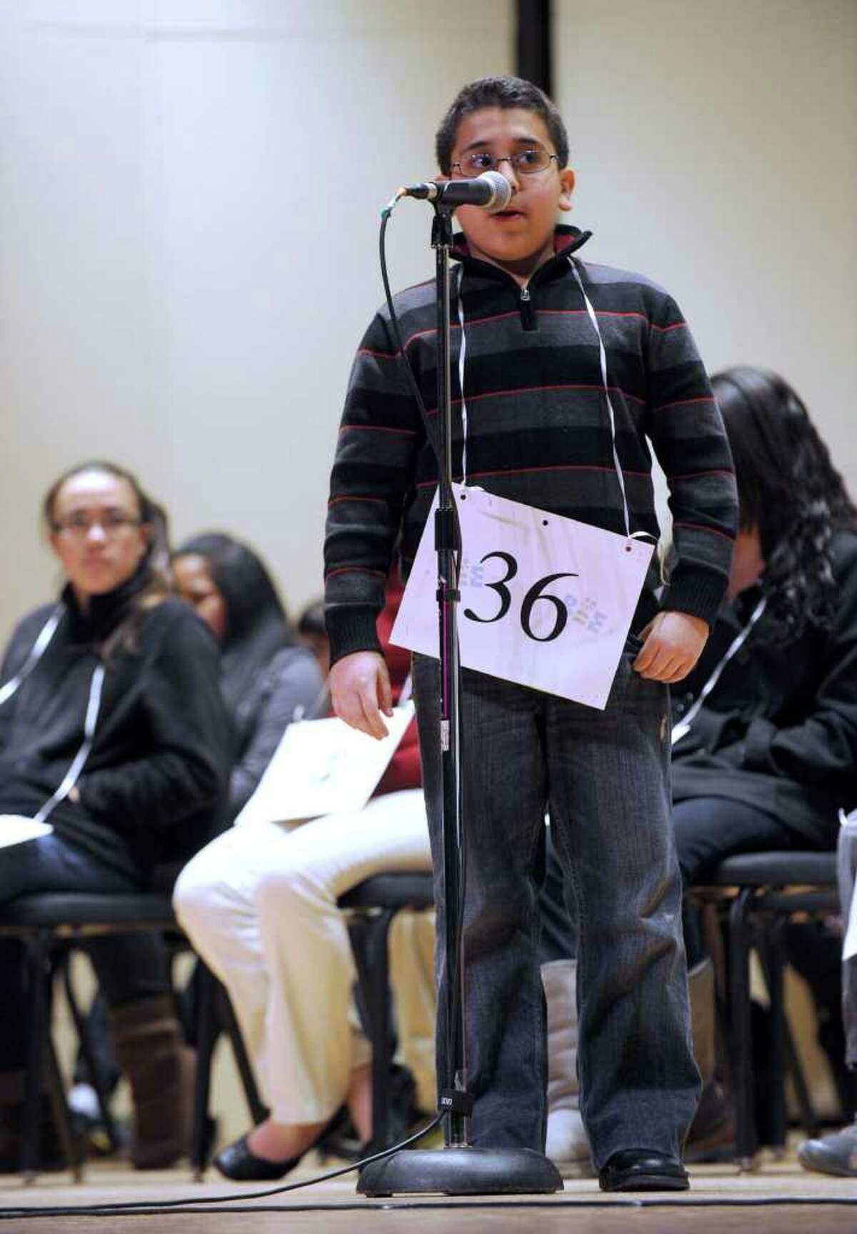 Abram Mikhaeel, 10, of Bridgeport, spells a word during the spelling bee.