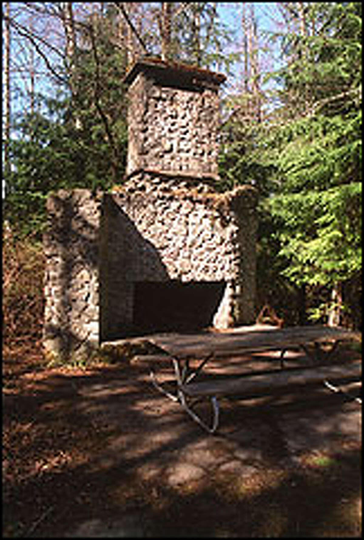 The fireplace and chimney are all that remain of the old Bullitt family homestead on Squak Mountain, now an excellent trailside picnic spot.