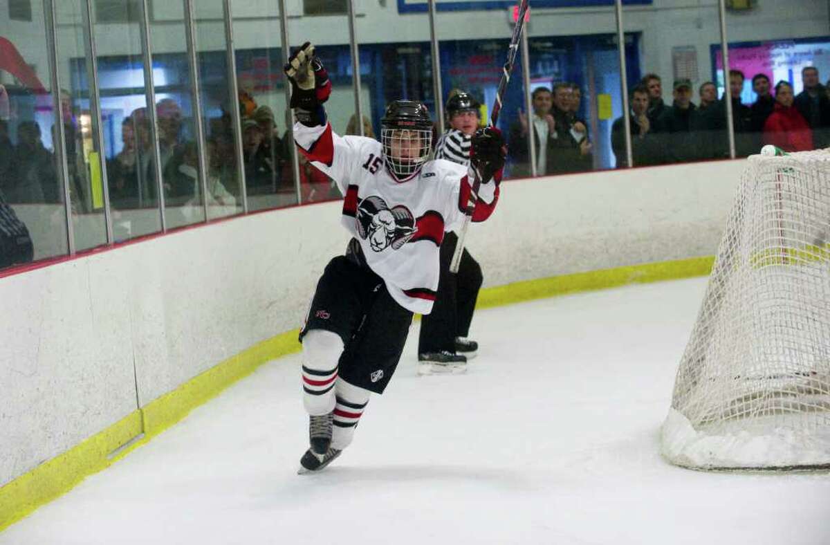 New Canaan's Dylan Hart reacts to his goal as New Canaan faces Greenwich in a boys hockey game at the Darien Ice Rink in Darien, Conn., March 9, 2011.