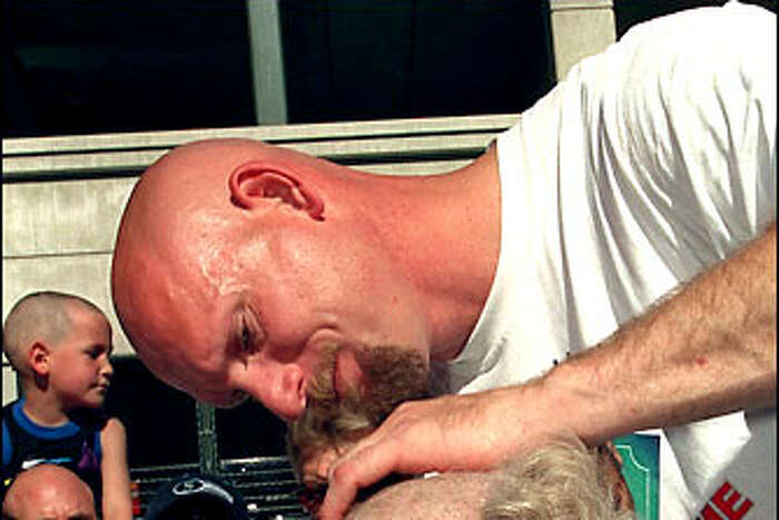 One of the greatest baseball promotions: Watch Jay Buhner shave heads for  'Buzz Cut Night