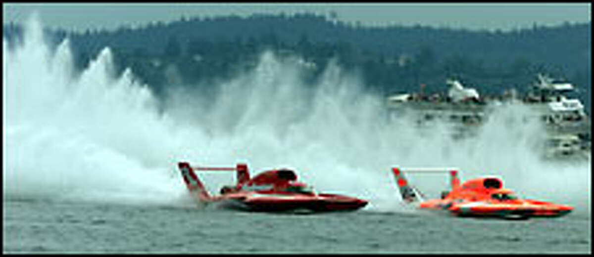 Miss Elam Plus, right, driven by Nate Brown, grabs an inside lane during the timed start of the final of the General Motors Cup on Lake Washington and pulls ahead of Miss Budweiser, which would never catch up. Click for a larger image
