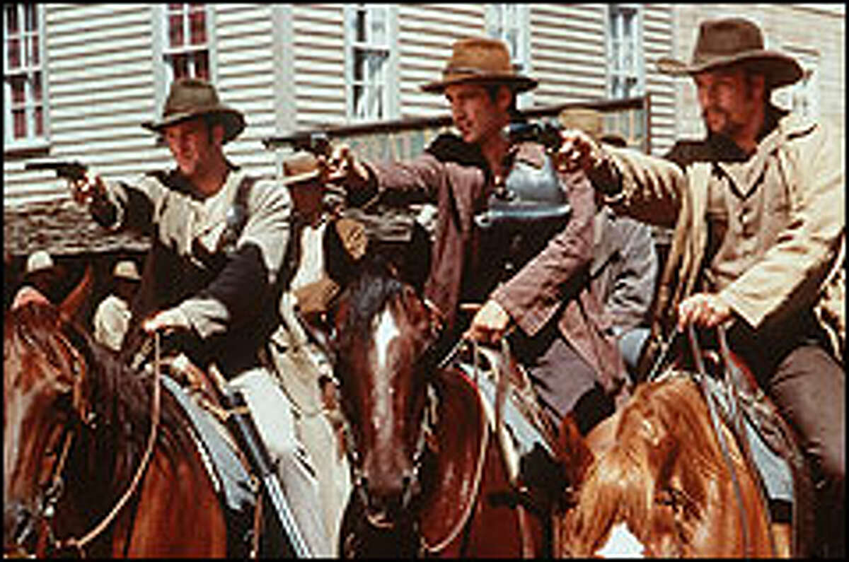 Jesse James (Colin Farrell, right) and a fellow James Gang-banger (Scott Caan) make a pointed demand in "American Outlaws."