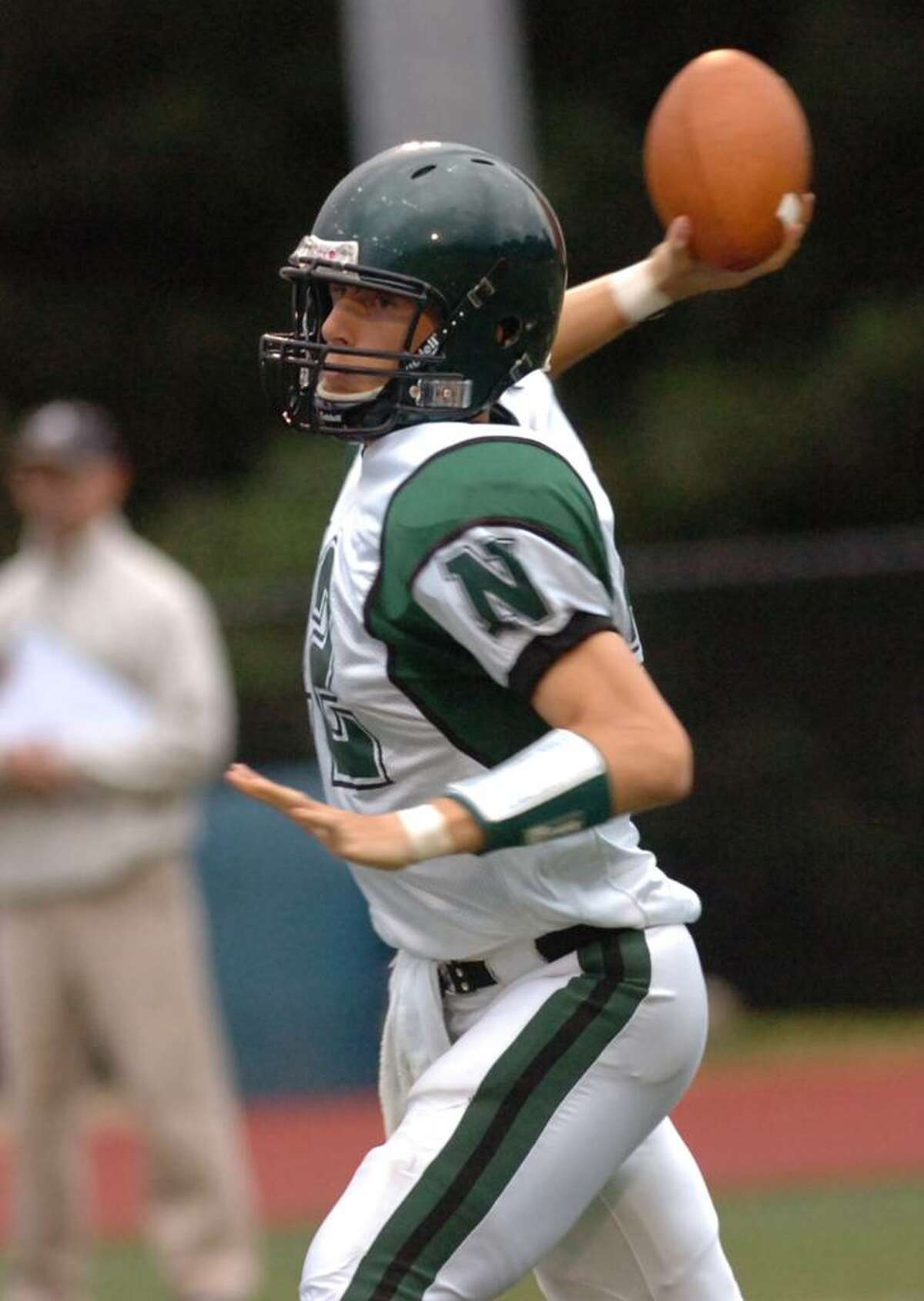 Norwalk Bear quarterback Andrew Krasnavage passes during game action. Greenwich High School meets Norwalk High School at Greenwich Cardinal Stadium for Greenwich football home opener Tuesday evening, Sept. 16, 2009.