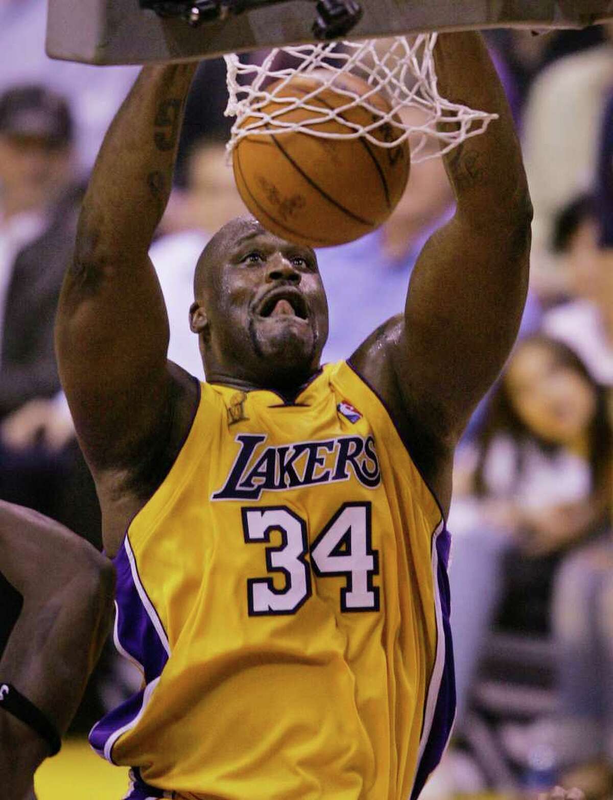 The Los Angeles Lakers' Shaquille O'Neal slam dunks against the Detroit Pistons in the third quarter of Game 2 of the NBA Finals in Los Angeles, Tuesday, June 8, 2004. (AP Photo/Chris Carlson)