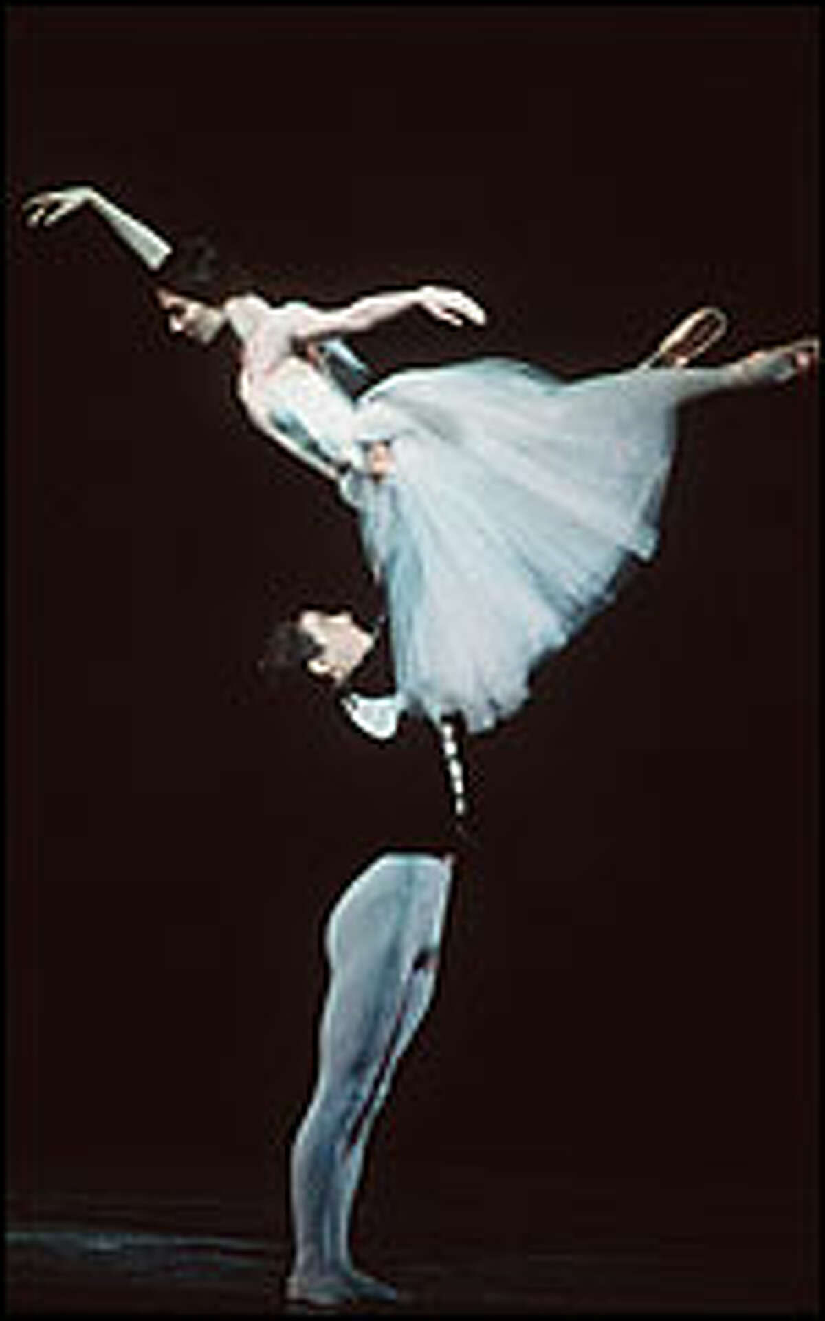 Giselle's spirit returns from the grave to forgive Albrecht, the man who betrayed her, in the second act of the ballet "Giselle." Ashley Tuttle dances the title role in the photograph above, and Angel Corella plays Albrecht.