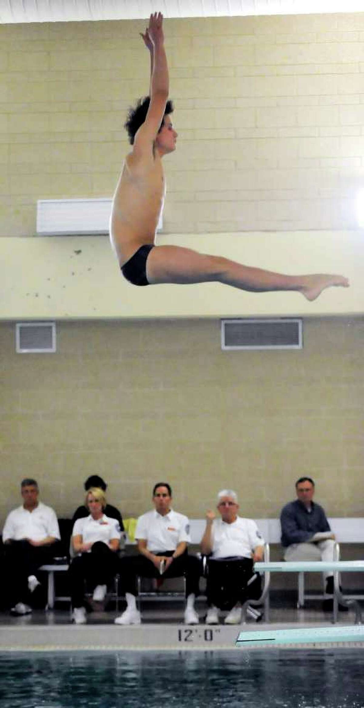 Connor Brisson of Greenwich High School competes in the Class LL Diving Finals at Hamden High School, Thursday, March 10, 2011.