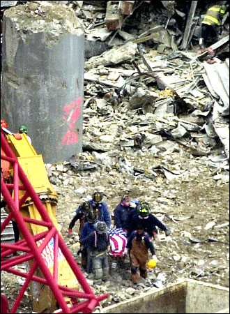 towers twin bodies remains found firefighters hand dust wreckage devastated ash sift searching human