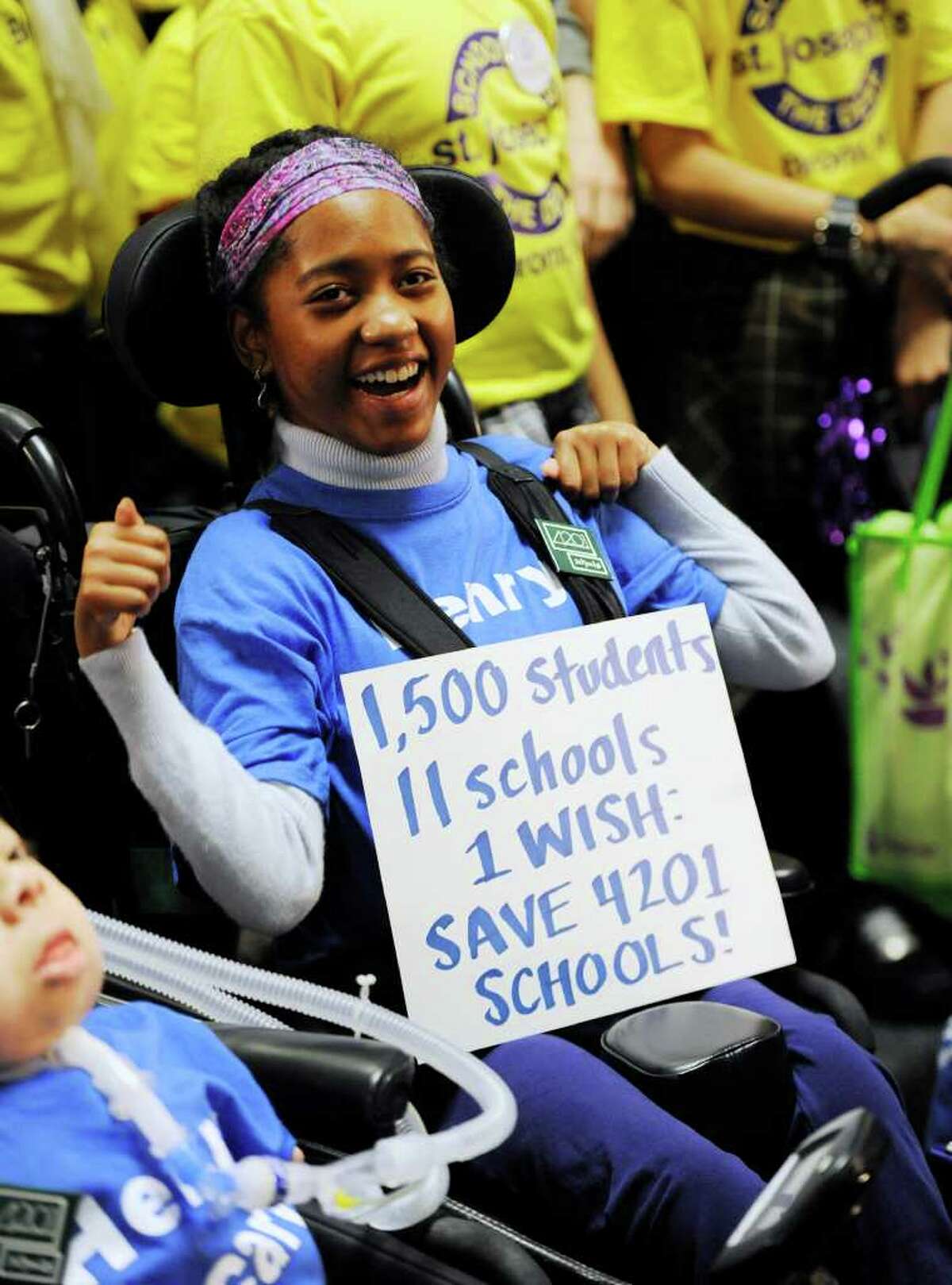 Merissa Johnson of the Viscardi School of Albertson, NY joins approximately 600 students with disabilities, parents and advocates in the well of the Legislative Office Building in Albany, New York to protest funding cuts to the states special needs programs March 10, 2011. (Skip Dickstein / Times Union)