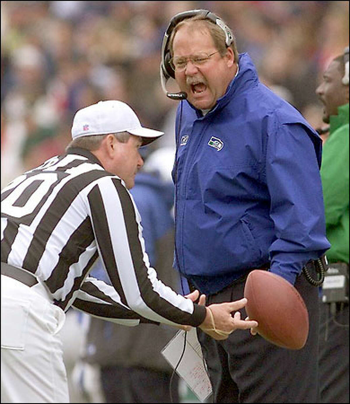 Seahawks coach/GM Mike Holmgren questions referee Larry Nemmers' ruling after Shawn Springs was penalized for unsportmanlike conduct against Denver on Oct. 14.