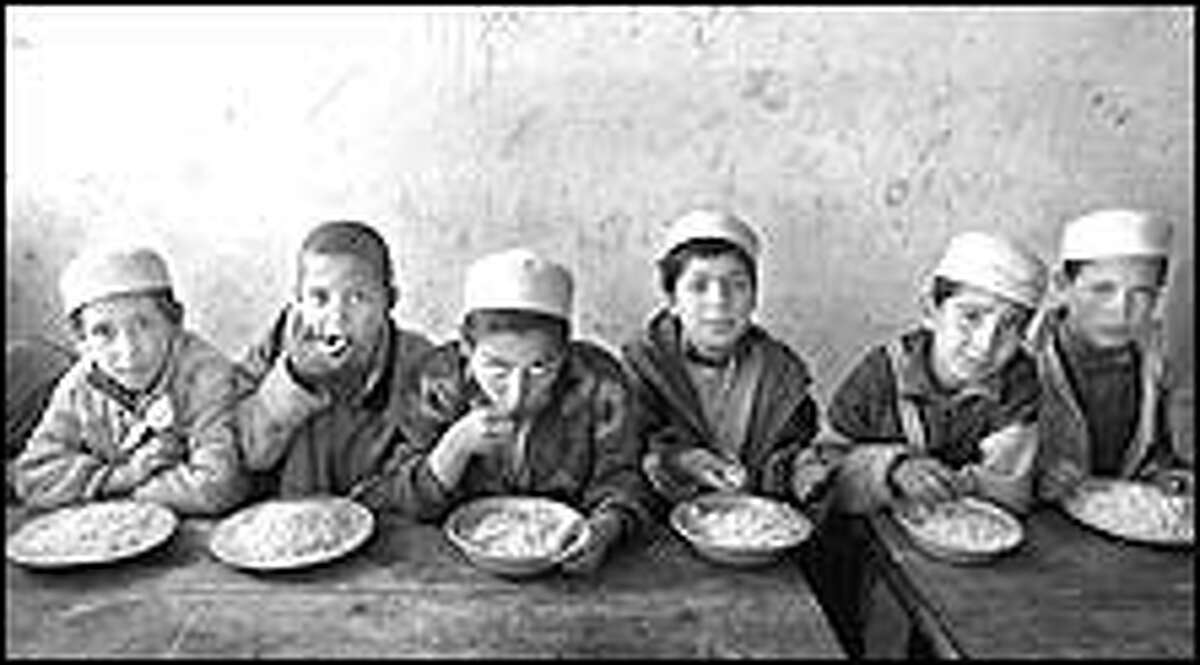 At a Kabul orphanage rice was the only thing left for these boys to eat after international aid organizations left the city in the wake of the U.S. war against the Taliban.
