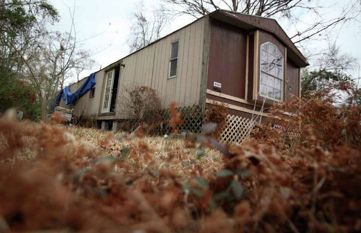 Nineteen men have now been accused in the sexual assault of an 11-year-old Cleveland Middle School girl. The Nov. 28, 2010 gang rape was recorded on cell phones and circulated around the school district. This is a photo of the abandoned manufactured home where the assault occurred on the 1700 block of Ross Ave. in Cleveland. ( Mayra Beltran / Chronicle )