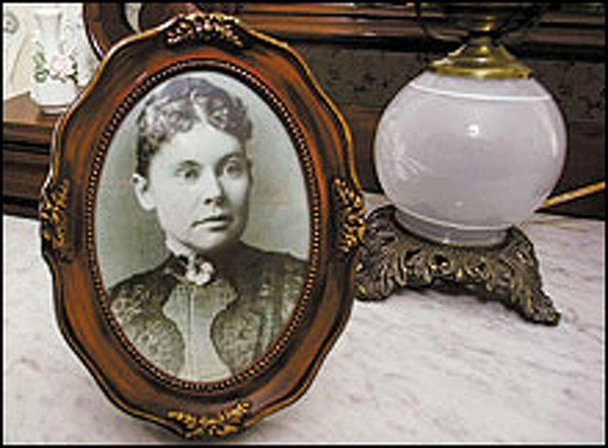 A portrait of Lizzie Borden adorns a bedroom in her namesake bed-and-breakfast in Fall River, Mass.