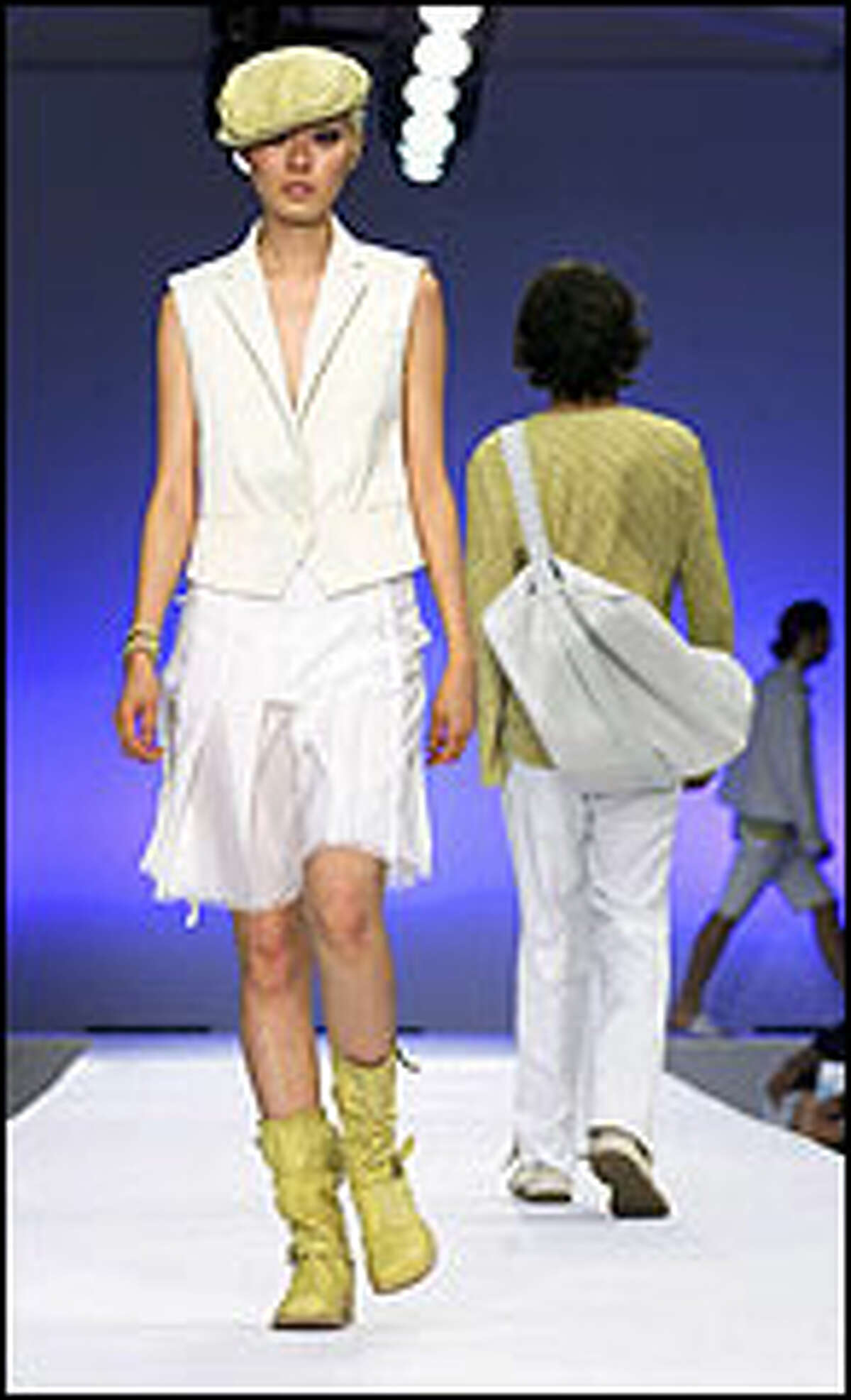 New for spring from Kenneth Cole is a white outfit with a flowy skirt. Whites, floral designs and looser fitting outfits are favored by retailers.