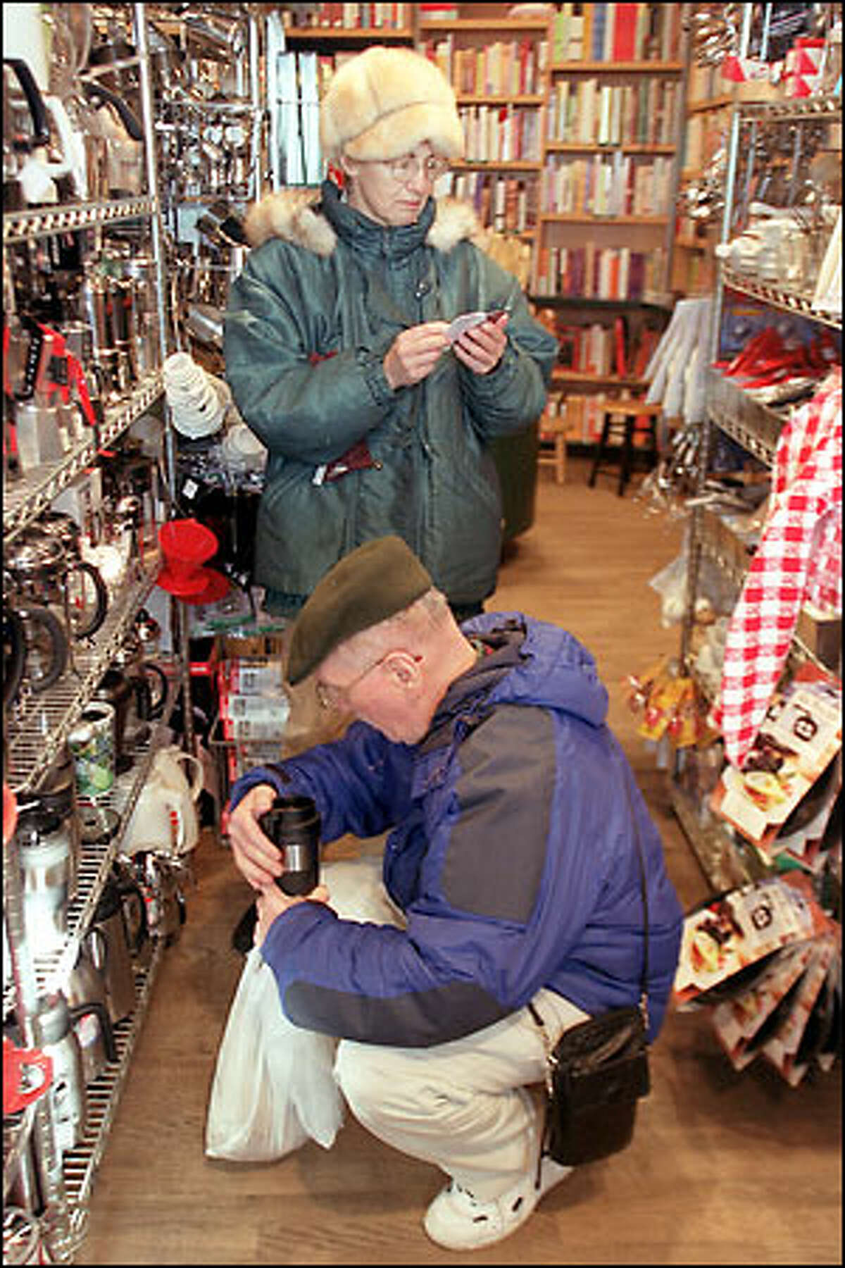 Ray and Marguerite Butz of Michigan check out the Sur La Table store in Pike Place Market. They say they go to the store when they're in Seattle and find things they can't find anywhere else. The business was founded by Shirley Collins in 1972.