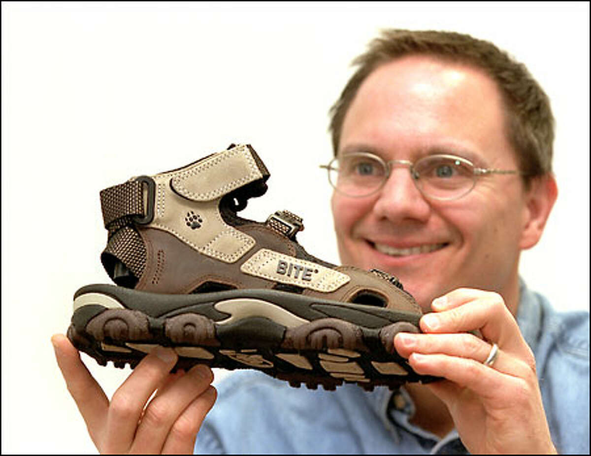Bite Footwear founder Dale Bathum displays a sandal for serious hikers. Four patents protect its design.