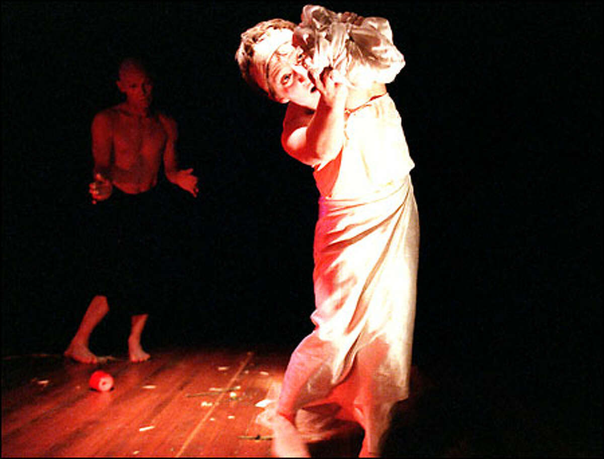 Alan Sutherland, in shadows, and Kristin Narcowich perform in the Laage home. Both are butoh dancers and music performers. Audiences of 20 to 30 people gain a closer-to-the-artist experience for a minimal monetary donation.
