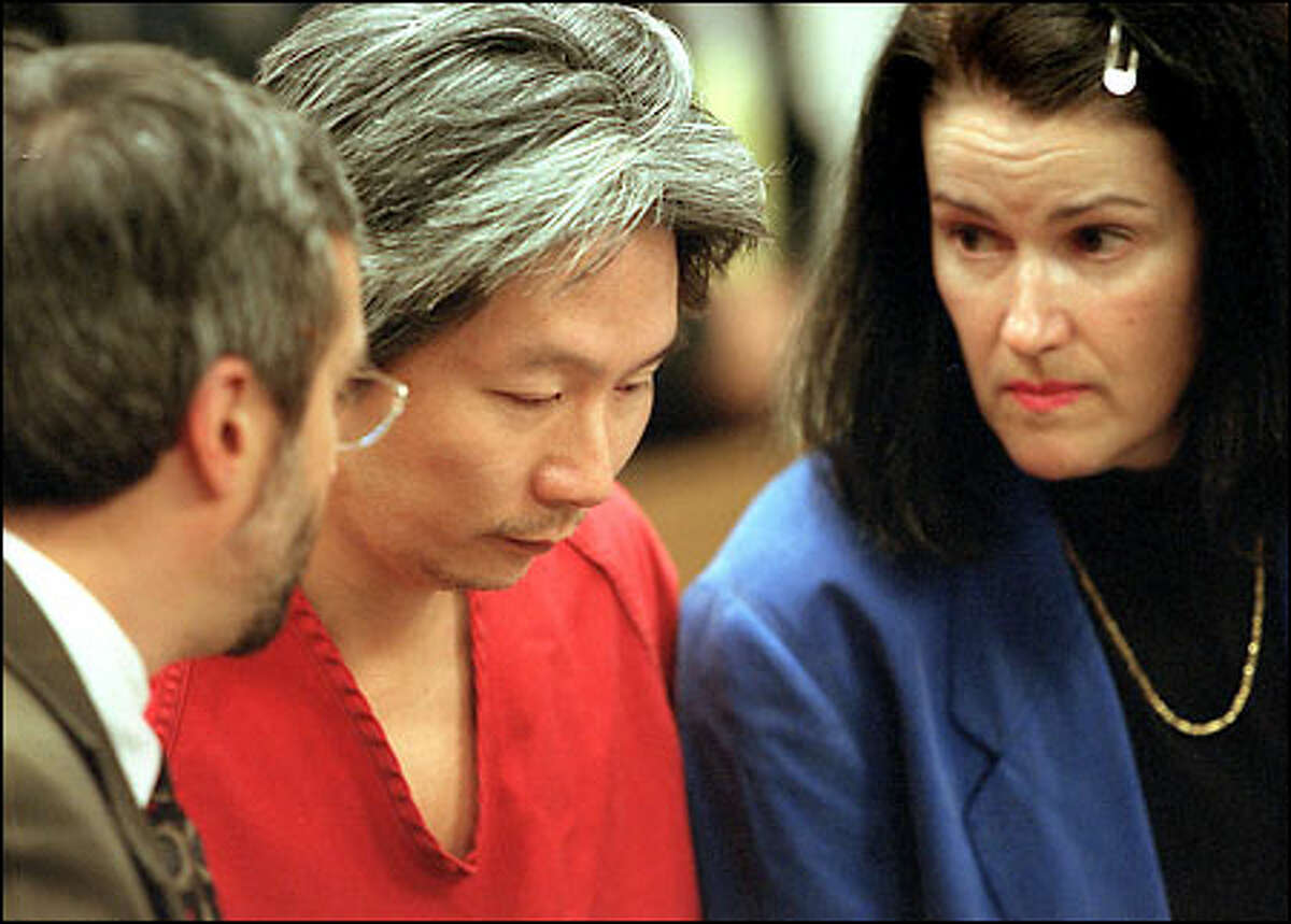 Kwan Fai "Willie" Mak listens to his attorneys, David Zuckerman, left, and Kathryn Ross, after Mak was formally sentenced to life in prison yesterday.
