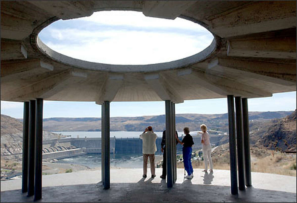 The grandest view of Grand Coulee Dam is from Crown Point Overlook State Park, which features a circular concrete viewing structure.