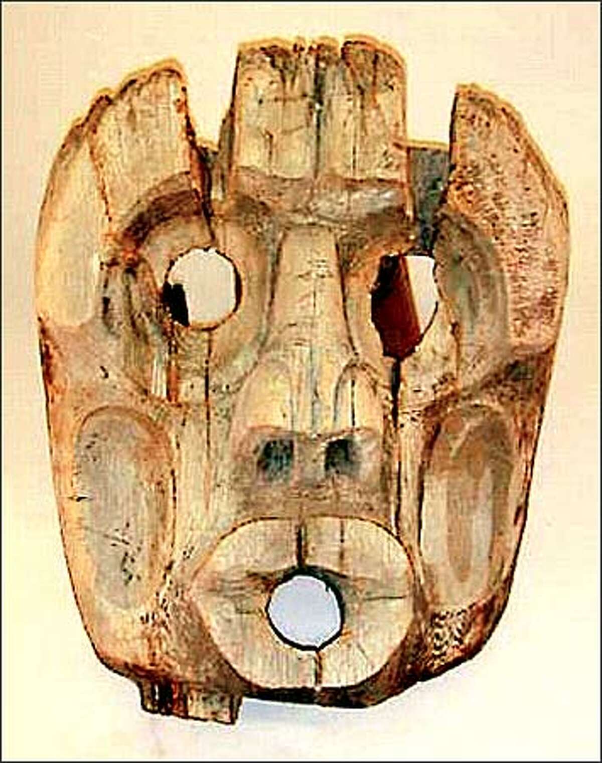 A small Kwakiutl Dzoon mask.