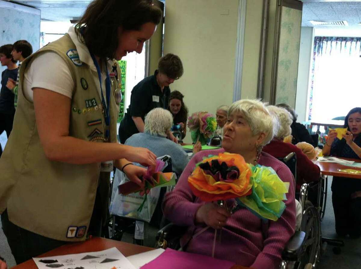 Molly Sperduti-Matesevac, left, with Nathaniel Witherell resident Luisa Falbo on Saturday, March 12, 2011. Sperduti-Matesevac, a Greenwich High School junior, launched the "Creative Craft Corner for Seniors" at the nursing home for her Girl Scouts Gold Award.