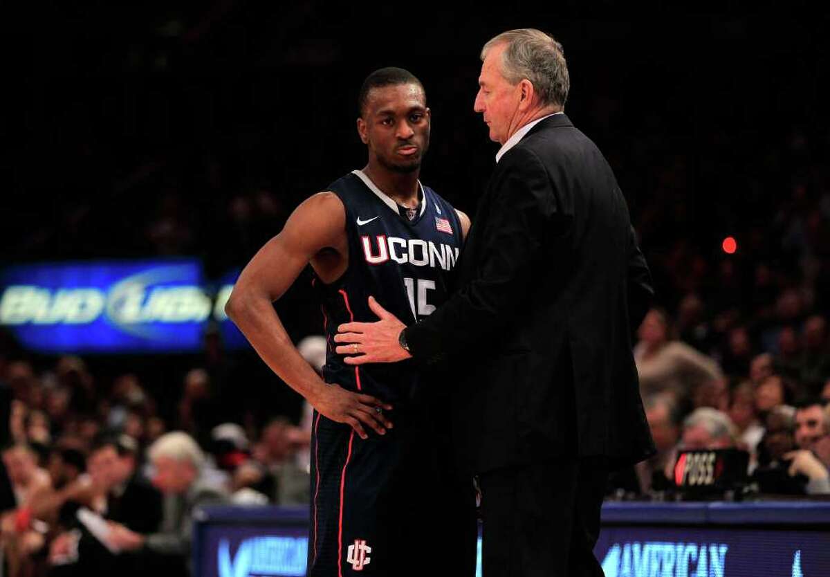 NEW YORK, NY - MARCH 12: Kemba Walker #15 of the Connecticut Huskies speaks with head coach Jim Calhoun during the championship of the 2011 Big East Men's Basketball Tournament presented by American Eagle Outfitters at Madison Square Garden on March 12, 2011 in New York City. (Photo by Chris Trotman/Getty Images) *** Local Caption *** Kemba Walker;Jim Calhoun