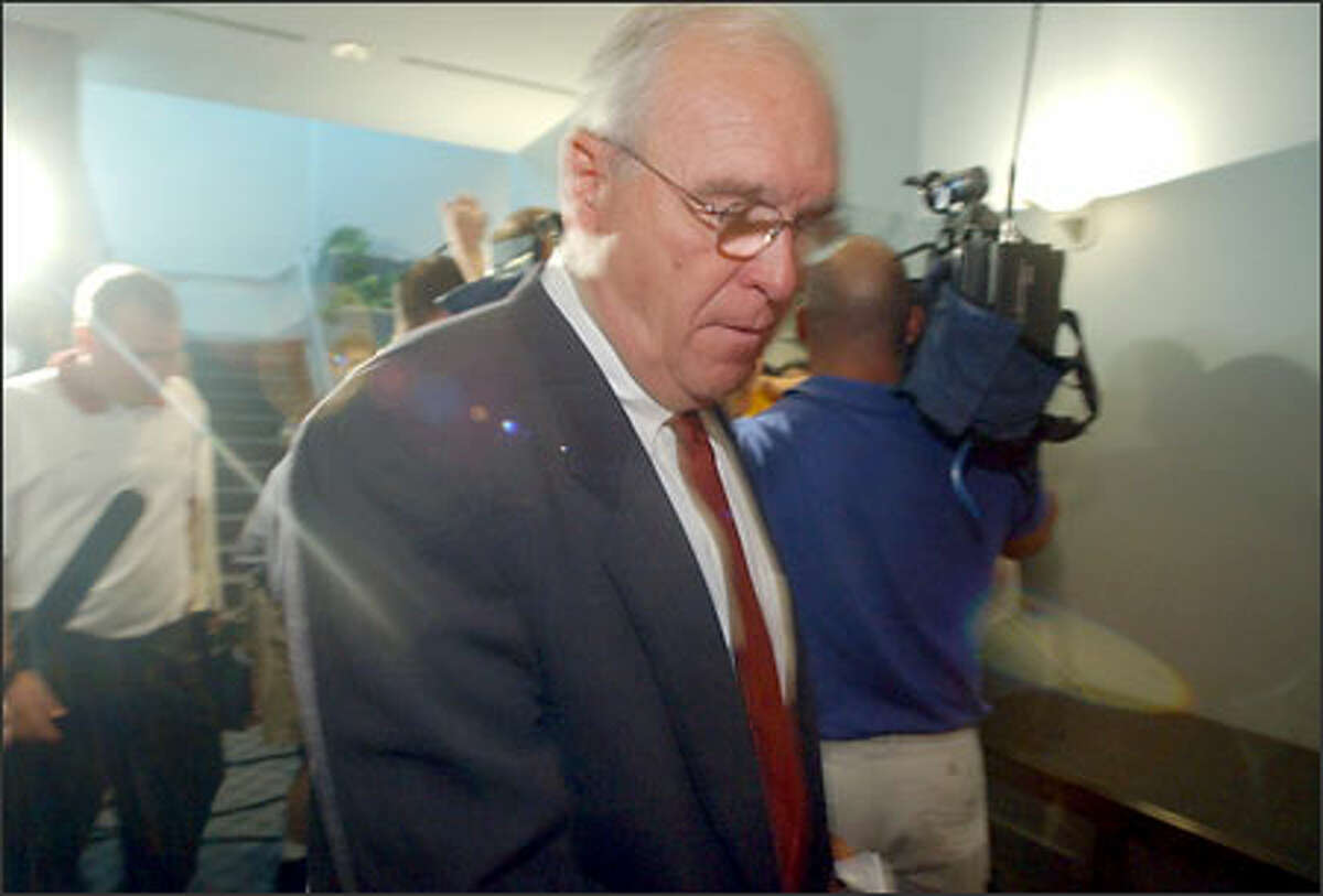 Alabama head football coach Mike Price enters a news conference prior to being fired by Alabama president Robert Witt after a board of trustees meeting Saturday, May 3, 2003, in Birmingham, Ala.