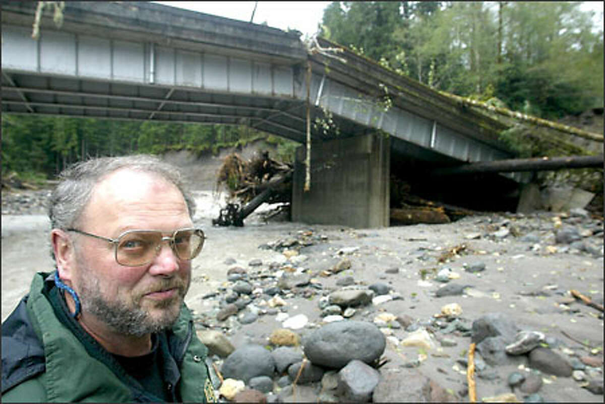 Ranger Terry Skorheim at the Whitechuck Bridge in the Mount Baker-Snoqualmie National Forest, which collapsed in last week's heavy rains.