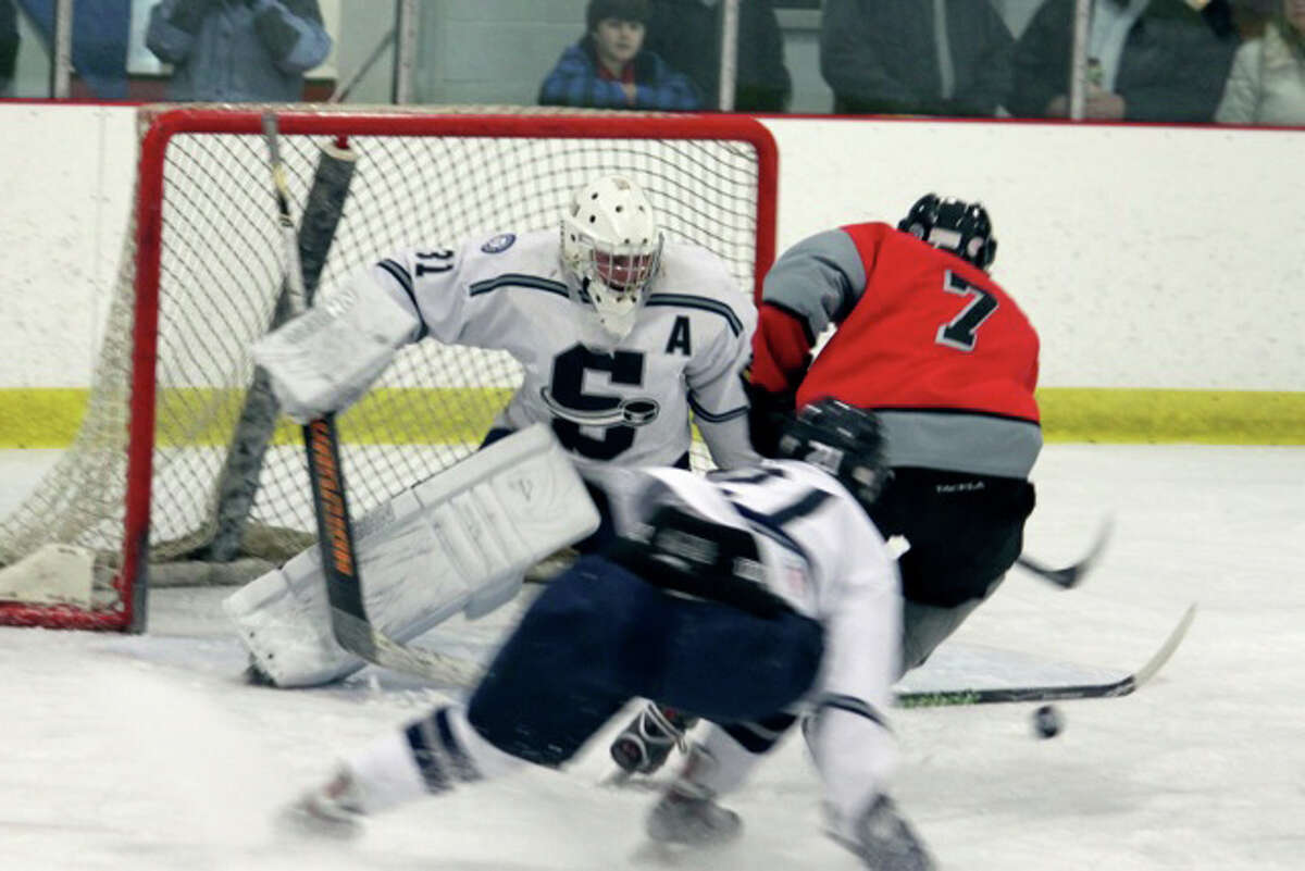 Staples senior alternate captain Luke Andriuk makes the save against St. Bernard in the Division III quarterfinals last Thursday. Andriuk made some big saves in overtime to preserve the tie before the Wreckers pulled out a 4-3 victory.
