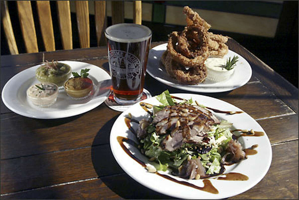 At Jolly Roger Taproom executive chef David Miller serves Smokers (smoked and fried onion rings) and tea-smoked duck Napoleon.