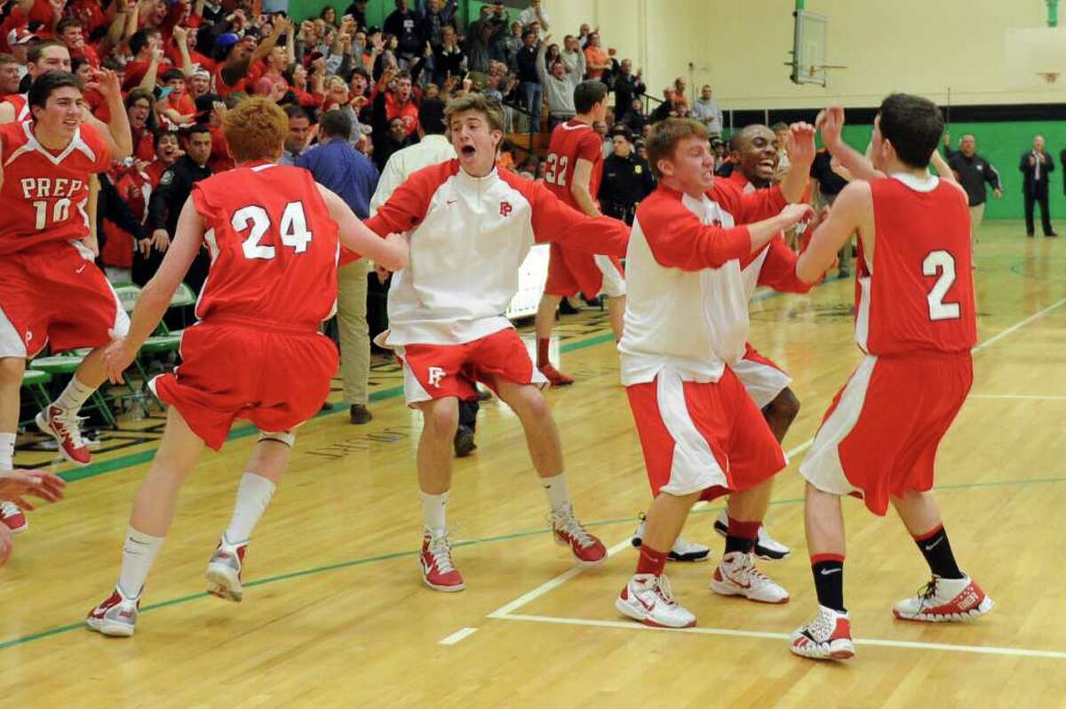 Fairfield Prep players react to winning Tuesday's class LL semifinal game at Wilby High School in Waterbury on March 15, 2011.