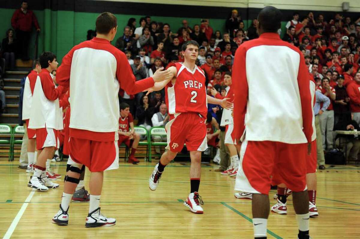 Fairfield Prep's Robbie Bier is welcomed to the court during Tuesday's class LL semifinal game at Wilby High School in Waterbury on March 15, 2011.