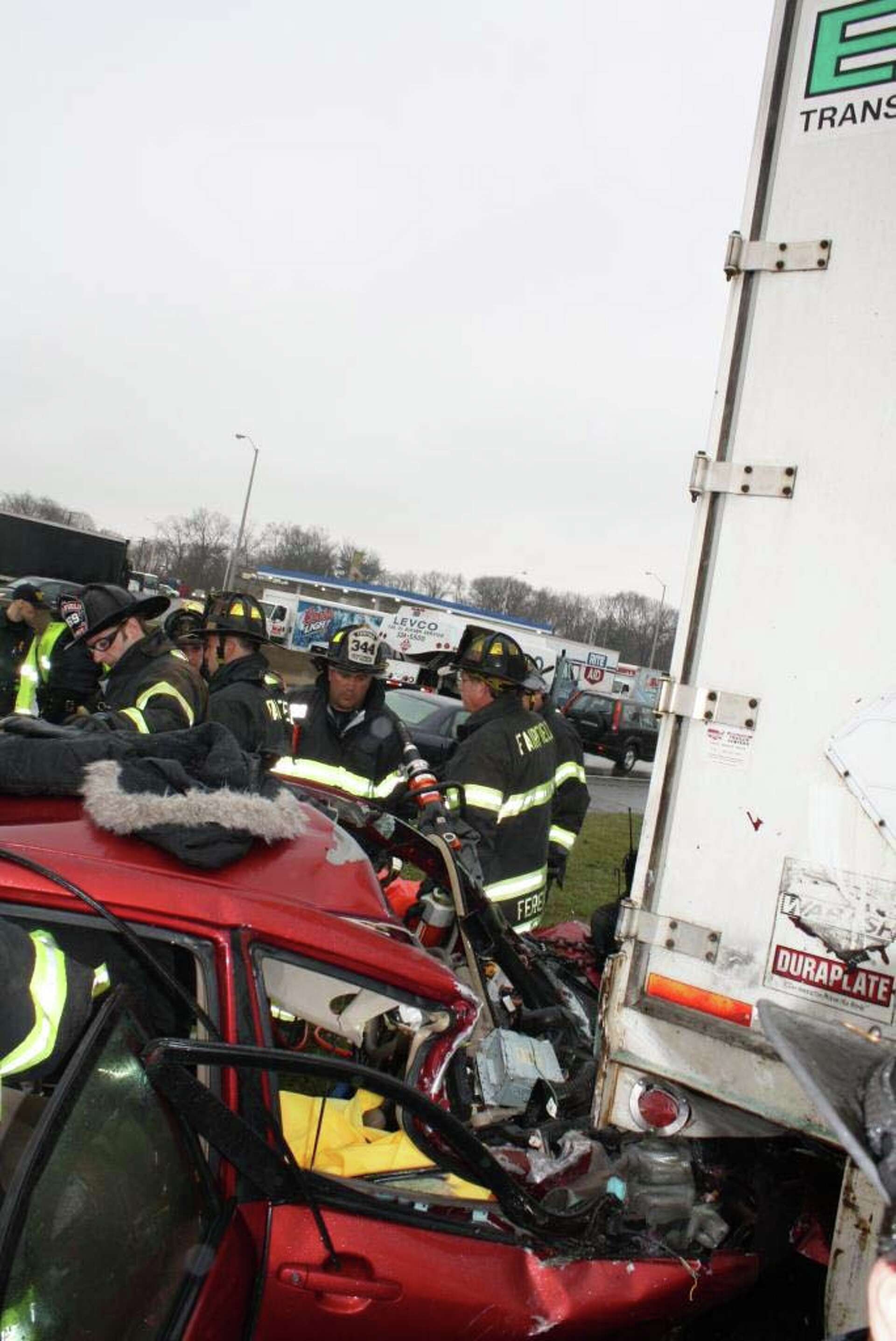 Driver hospitalized after car stuck under tractor trailer in I-95 ...