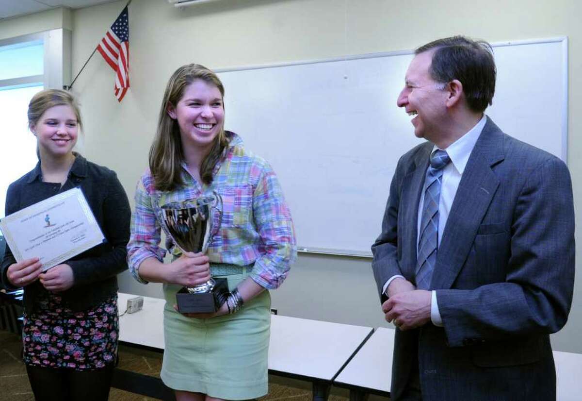 Fairfield First Selectman Ken Flatto congratulates Fairfield girls Ski Team co-captains, Lydia Brown, left, and Brooke Mackno on their state championship win Wednesday, Mar. 16, 2011 at Fairfield Warde High School.