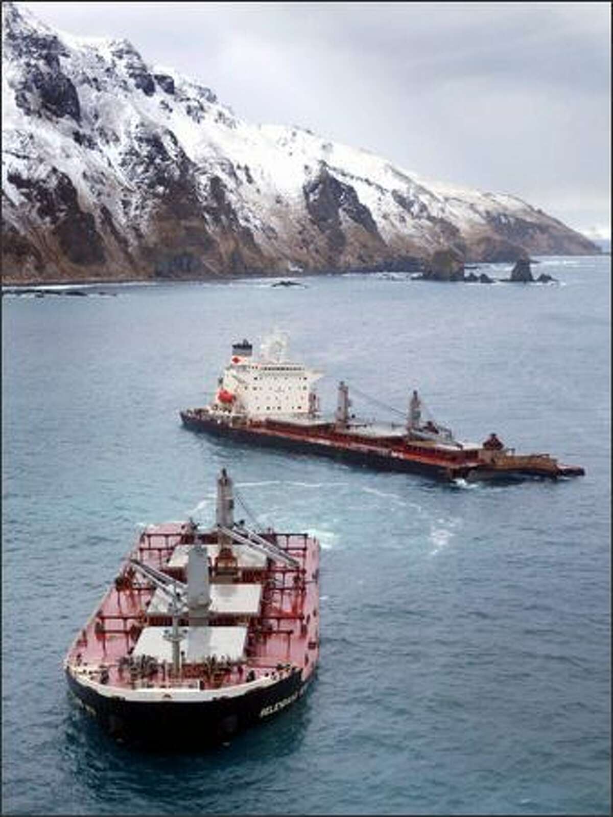 The Selendang Ayu sits near Skan Bay yesterday near Dutch Harbor, Alaska. The ship ran aground and spilled bunker fuel. Six crew members died.