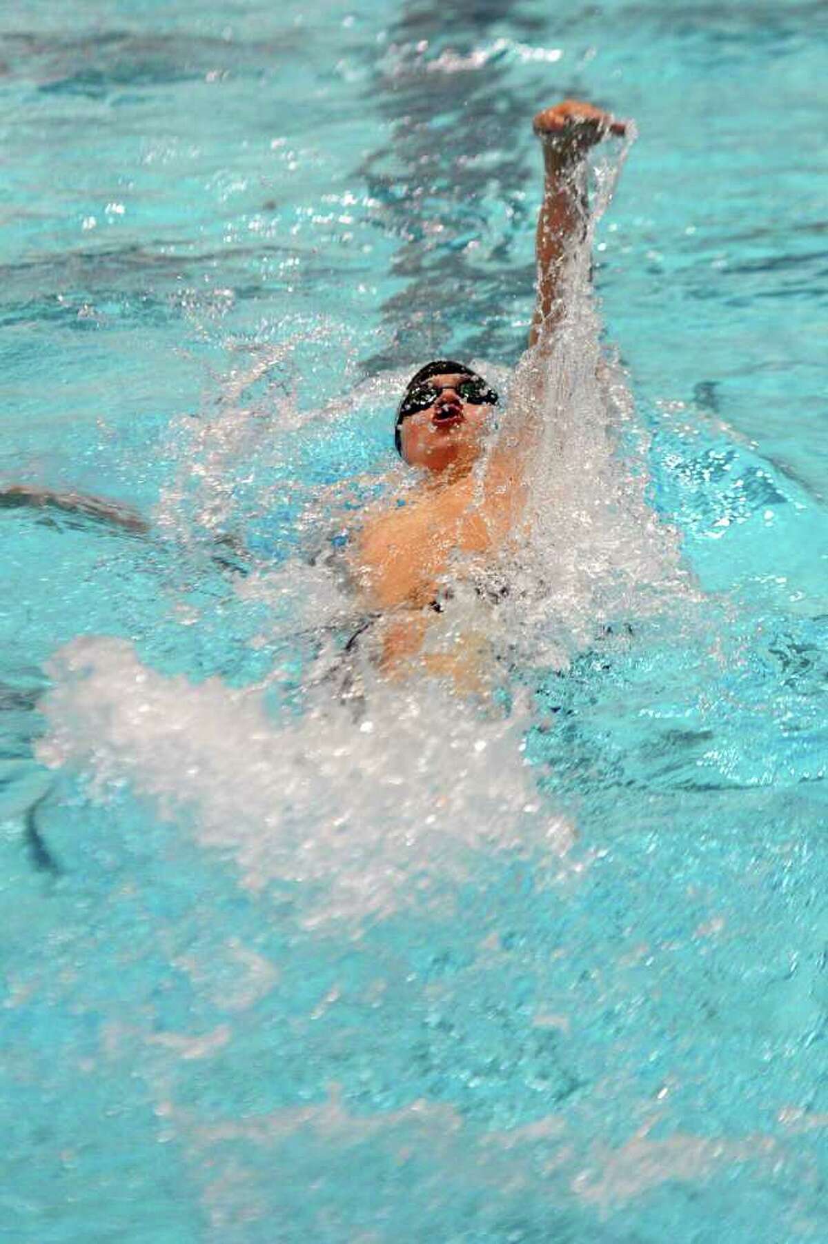 New Canaan's Brian Bodick competes in the first heat of the 200-yard individual medley during Tuesday's Class M Championship meet at Wesleyan University on March 16, 2011.