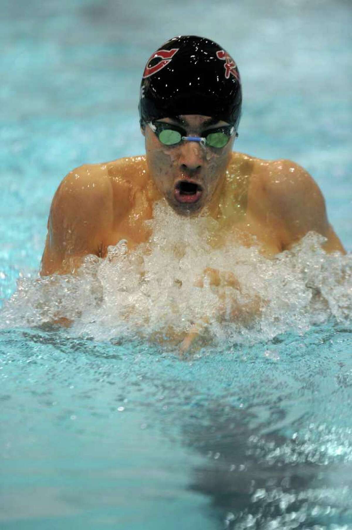 New Canaan's Gabe Lane competes in the second heat of the 200-yard individual medley during Tuesday's Class M Championship meet at Wesleyan University on March 16, 2011.