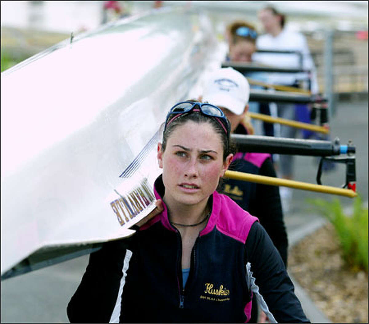 UW rower Marah Connole and her teammates load their boat for the NCAA championship this weekend.