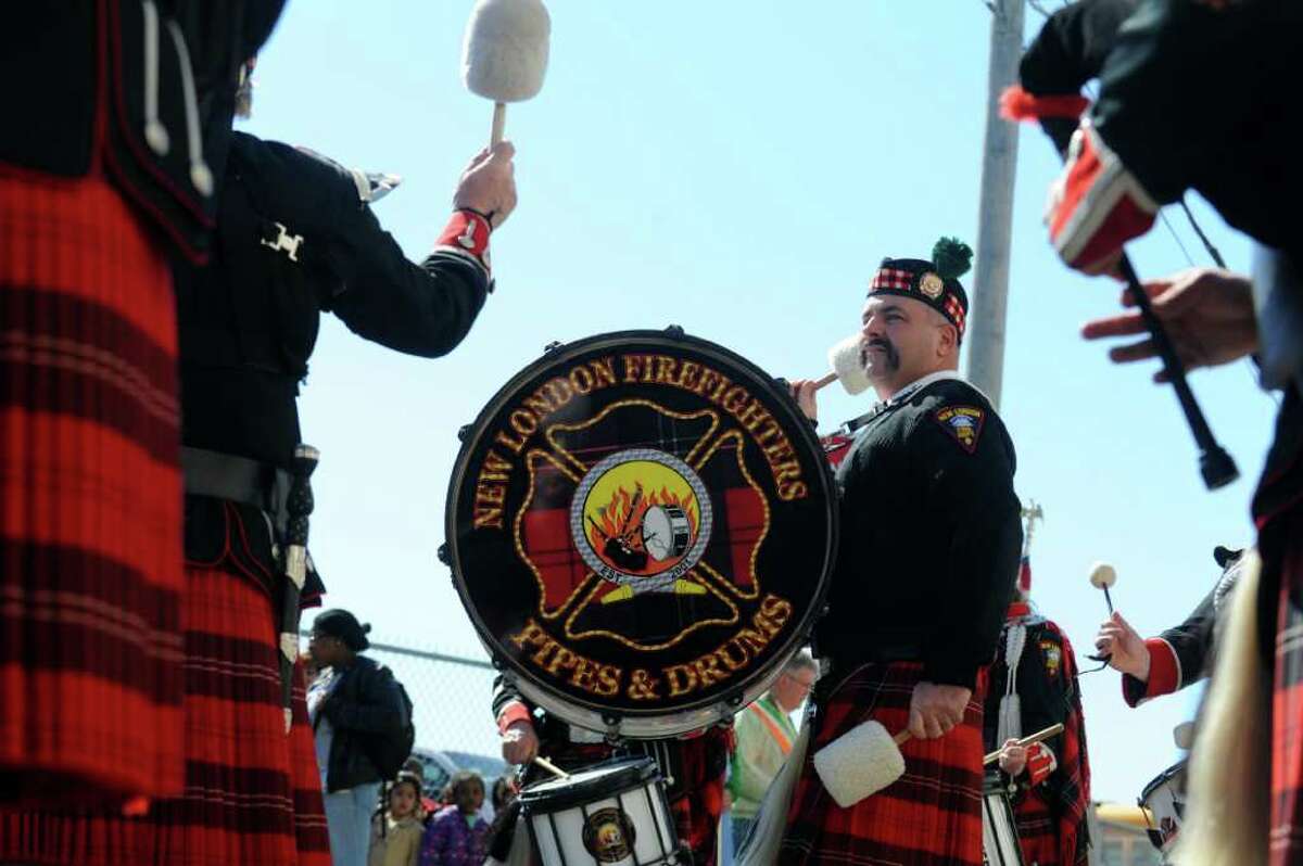 Jo Nott warms up with the New London Firefighters Pipes and Drums Corps.