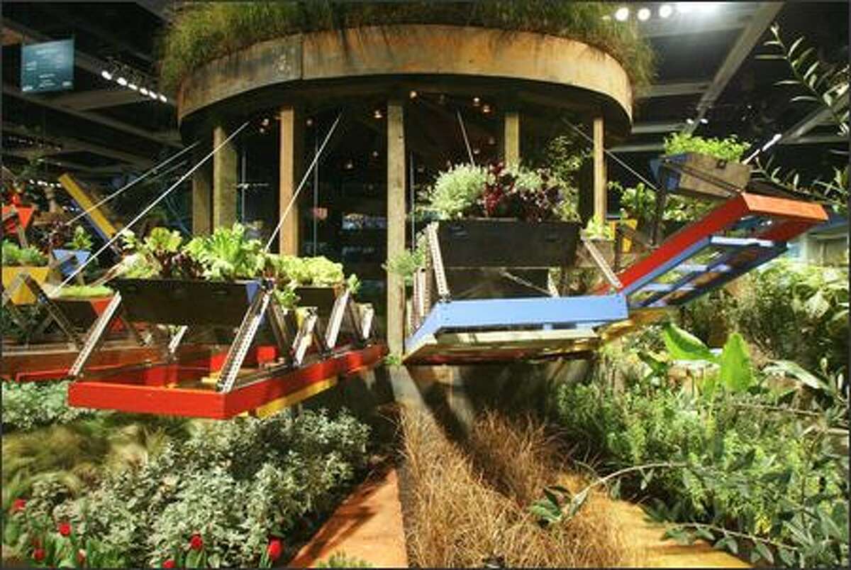 A view of the Seattle P-I and Seattle Tilth display garden at the Northwest Flower and Garden Show titled "Feel the Heat." The garden, designed by Cameron Scott, won the Pacific Horticulture Magazine Award, the People's Choice Award, the Exhibitor's Award and a Sliver Medal.