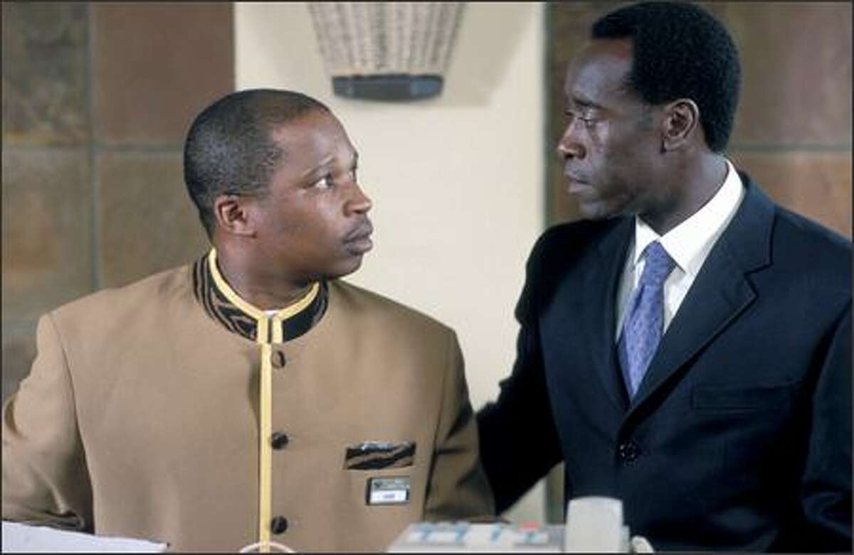 Don Cheadle (right) stars in "Hotel Rwanda," a true story about internal strife in the African nation in the 1990s.