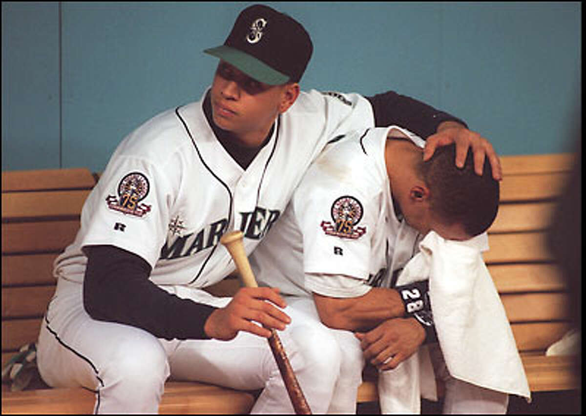 1995: Alex Rodriguez comforts distraught teammate Joey Cora after the Mariners are eliminated from the American League Championship Series by the Cleveland Indians.