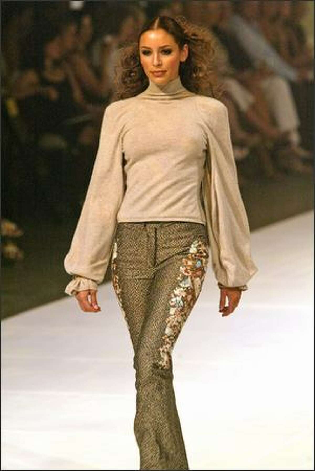 ZAC POSEN COLLECTION: Oatmeal cashmere admiral turtleneck with billow sleeves. Tan embroidered "Antoinette" pants.
